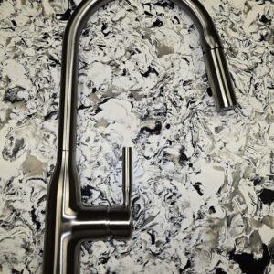 High-quality kitchen faucet with sleek design, durable construction, and versatile functionality. Features pull-down sprayer, easy-clean nozzle, and water-saving technology for efficient home use.